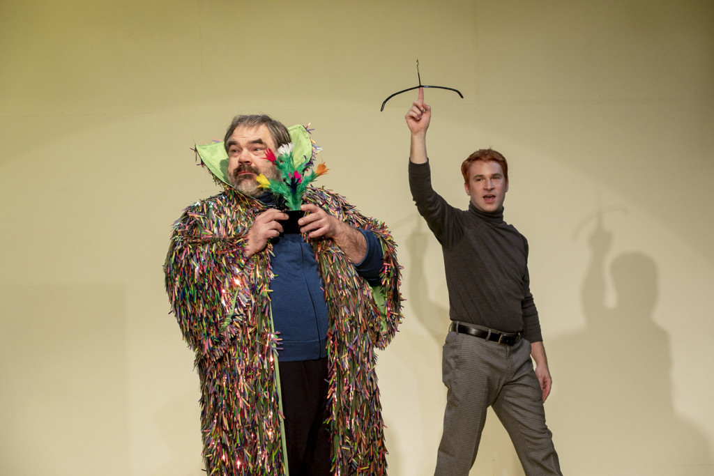 Scene photo of a performance: Two men are on a stage.